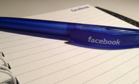 Facebook 6 pen on notebook
