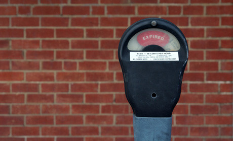 Parking meter and wall