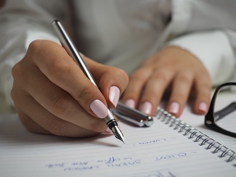 woman writing pencil paper